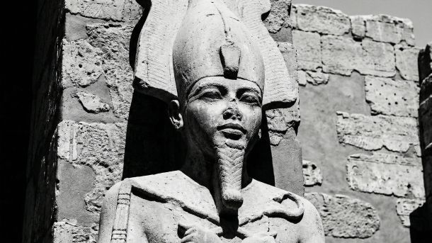 Stone carving of an ancient deity representing male strength and potency.